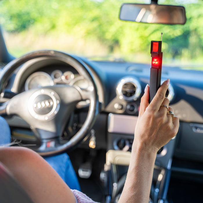 Checking a car for GPS trackers with the detector